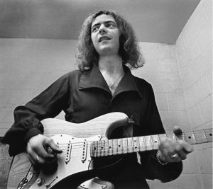 West Palm Beach, FL – MARCH 24, 1971: Deep Purple guitarist Ritchie Blackmore tunes up his guitar before a concert in West Palm Beach; Florida.