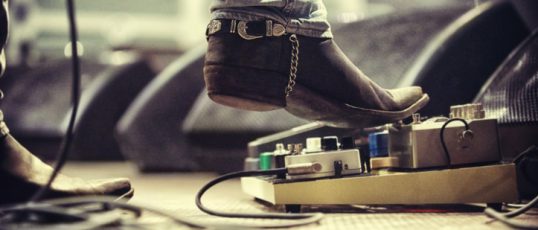 Cropped shot of a music artist's foot on a foot pedal. This concert was created for the sole purpose of this photo shoot, featuring 300 models and 3 live bands. All people in this shoot are model released.http://195.154.178.81/DATA/i_collage/pi/shoots/782610.jpg